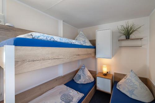 Ένα ή περισσότερα κρεβάτια σε δωμάτιο στο Bootshaus Fritze Bollmann