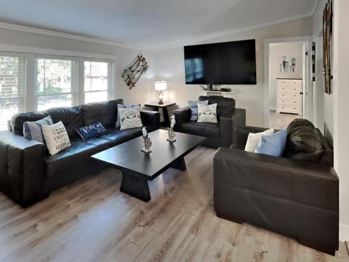 a living room with couches and a coffee table at Put-in-Bay Island Club #66 in Put-in-Bay