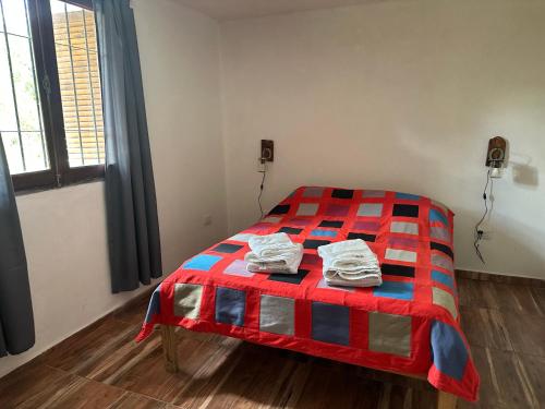 Postel nebo postele na pokoji v ubytování Cabaña El Quebrachal