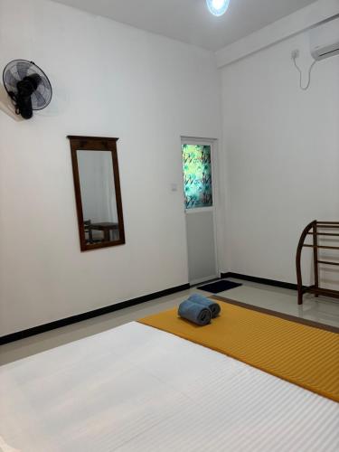 Postel nebo postele na pokoji v ubytování Eagle Wings Mirissa