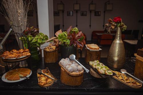 a table topped with lots of different types of food at Azalaï Hôtel Nouakchott in Nouakchott