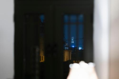 a view of a city from a window at night at Beijing Xiaofengxian Former Residence Hotel Tiananmen Square Qianmen Store in Beijing