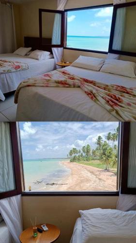 a room with two beds and a window with a beach at Pousada Dra Lindalva in Maragogi