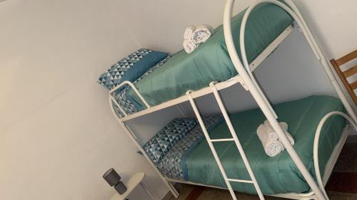 En eller flere senge i et værelse på Casa vacanze Nunù