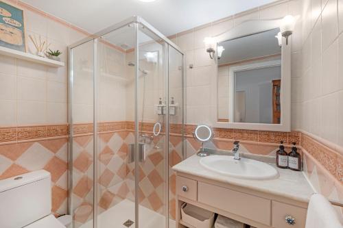 a bathroom with a shower and a sink at Casa Eusebia in Arona