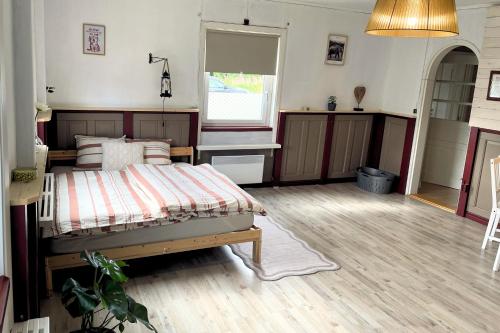 Ένα ή περισσότερα κρεβάτια σε δωμάτιο στο Gemütliche Ferienwohnung in Nordschweden