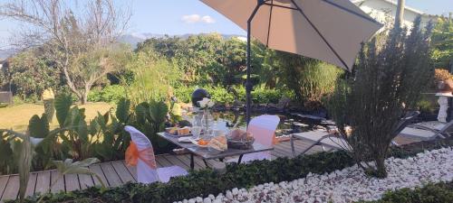 Dārzs pie naktsmītnes Enjoy