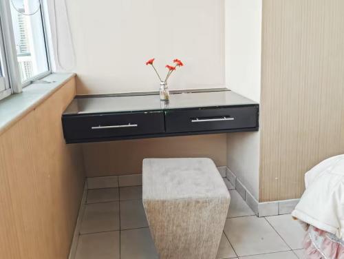 a bathroom with a black sink and a stool at Newly Large 2BR Ambassador2 Apt with Pool Gym WiFi in Jakarta
