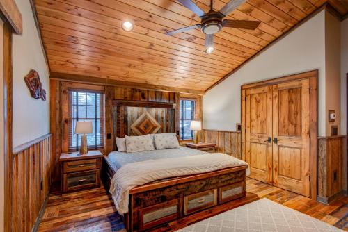 a bedroom with a bed and a wooden ceiling at Rivers Edge at Eagles Nest in Banner Elk