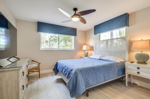 a bedroom with a bed and a ceiling fan at Spacious Yard, Near Golf Modern Home in Hollywood in Hollywood Beach