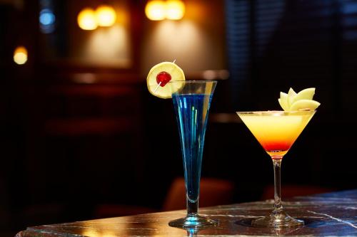 two cocktails sitting on top of a table at Hôtel Régent Contades in Strasbourg
