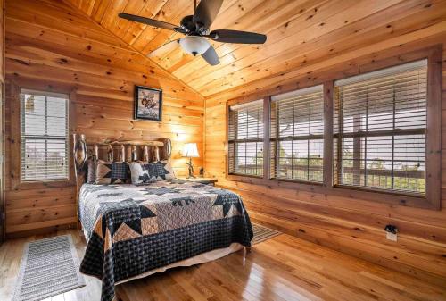 a bedroom with a bed and a ceiling fan at Blue View Mountain in Murphy