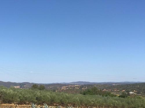 a view of a city from a hill at HACIENDA LA MACARENA DE SEVILLA in Cantillana