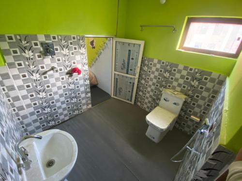 a bathroom with a sink and a toilet at Home made guest house and netflix in Bhaktapur