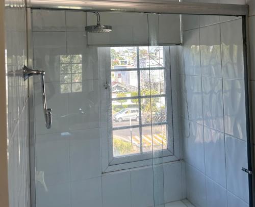 a bathroom with a shower and a window at Modern room with balcony in Mexico City