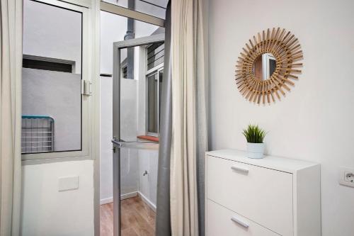 a bathroom with a mirror and a white dresser at Mypris Home 2 in Tacoronte