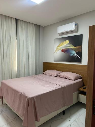 Ένα ή περισσότερα κρεβάτια σε δωμάτιο στο Casa Lírio Bananeiras