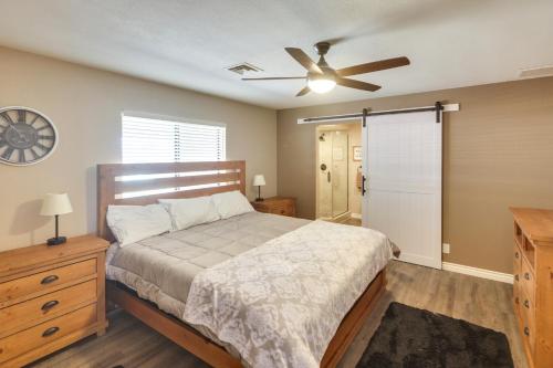 a bedroom with a bed and a ceiling fan at 2 Mi to Lake Havasu Home with Patio and Pool in Lake Havasu City