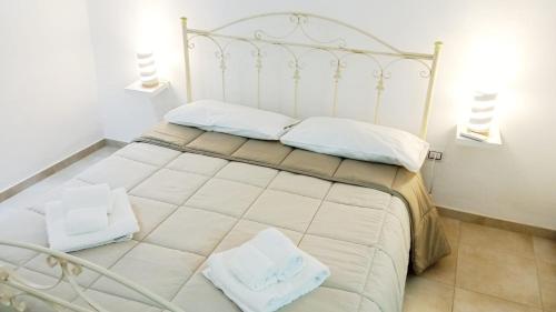 Postel nebo postele na pokoji v ubytování Casa Vacanza Terra del Primitivo