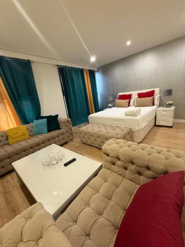 a living room with a bed and a couch at Gre Hostel San Benito in Madrid