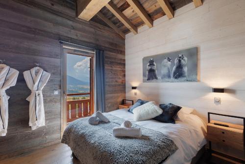 a bedroom with a bed and a large window at Chalet Vista - Bolquère in Bolquere Pyrenees 2000