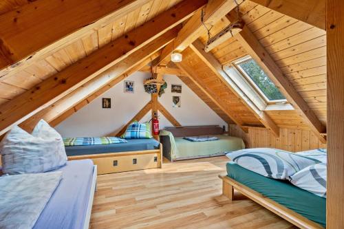 a room with two beds in a attic at Kletterhütte Sächsische Schweiz in Lohsdorf