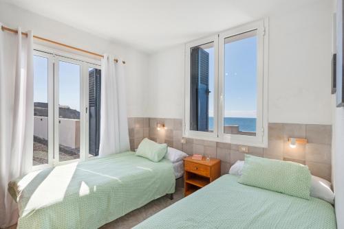 Giường trong phòng chung tại La Bayana Apartments - 2