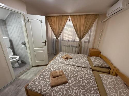 Ліжко або ліжка в номері Smeštaj Kula