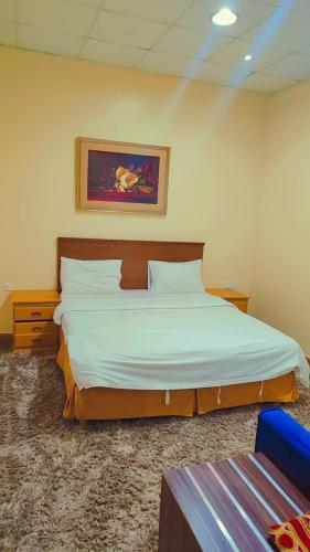 Ένα ή περισσότερα κρεβάτια σε δωμάτιο στο منتجع سيتي لاند فله رقم 1