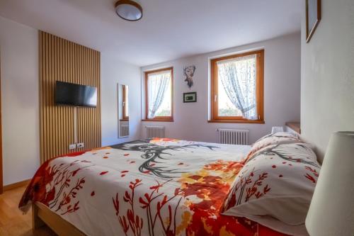 Postel nebo postele na pokoji v ubytování Happy Guest Apartments - Casa Alpi Orange