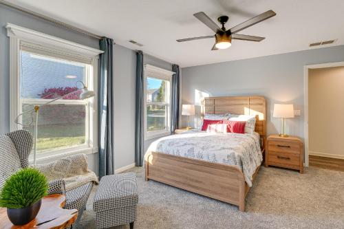 a bedroom with a bed and a ceiling fan at Private Yard and Pond Views Fort Wayne Family Home! in Arcola