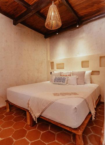 Ένα ή περισσότερα κρεβάτια σε δωμάτιο στο Casona Tunan