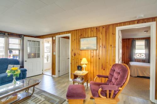 a living room with a couch and a chair at Cozy Hampton Cottage - Walk to Beaches and Marina! in Hampton
