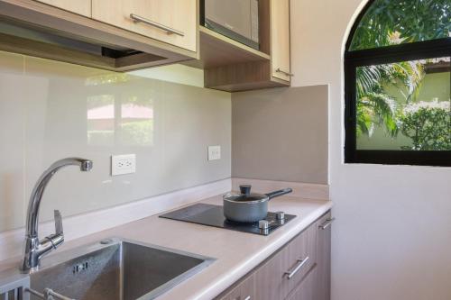 Η κουζίνα ή μικρή κουζίνα στο Villaggio 1 Apartments