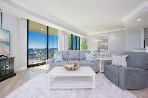 a living room with a couch and a table at Phoenix on the Bay 1134 condo in Caswell