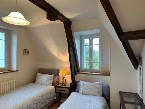 Llit o llits en una habitació de Chateaueden