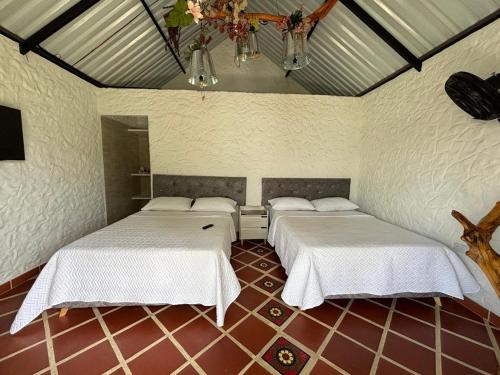 Ένα ή περισσότερα κρεβάτια σε δωμάτιο στο Cabañas Villa del Prado