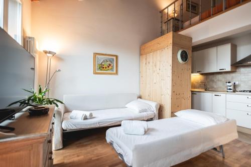 En eller flere senge i et værelse på Ravenna Sunrise Loft, Centro Storico