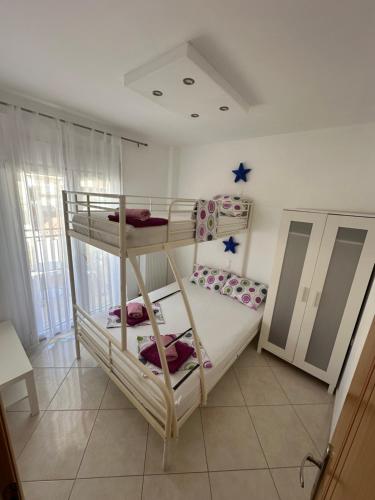 a room with two bunk beds in it at Dimi Apartments in Metamorfosi