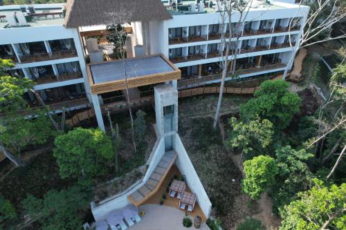 an overhead view of a building with a building at Hotel Mundo Maya Palenque in Palenque