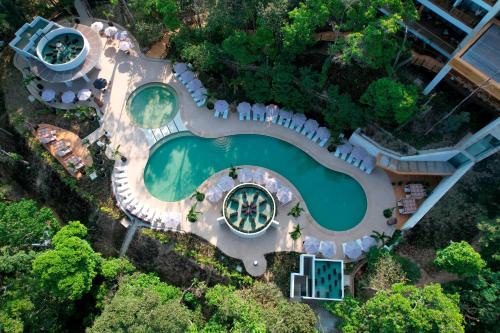 an aerial view of a house with a swimming pool at Hotel Mundo Maya Palenque in Palenque