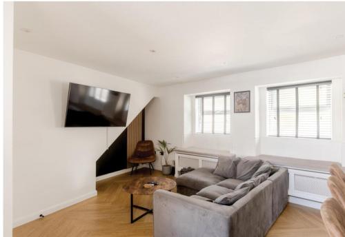 a living room with a couch and a table at Entire house, close to central Bristol in Bristol