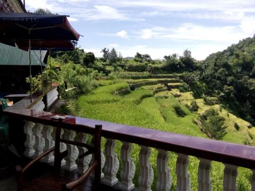 a view from the balcony of a house at Bogah Lodge in Banaue