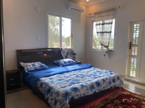 Postel nebo postele na pokoji v ubytování Kebbeh Apartments