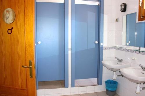 a bathroom with a glass shower and a sink at Allucant - Gallocanta in Gallocanta