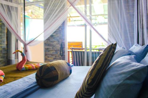 a room with a bed with pillows on the floor at Secret View Homestay Ella in Ella