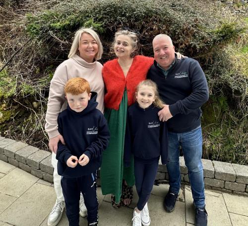 a group of people posing for a picture at BayView Lodge 4-Bedroom Penthouse Apartment in Downings