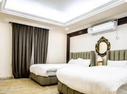 Postel nebo postele na pokoji v ubytování daniel's village