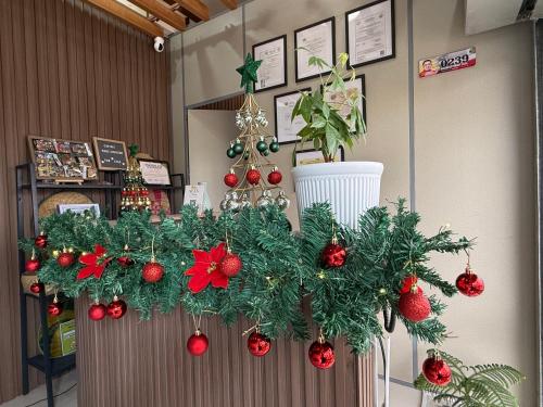 a christmas wreath on a counter in a store at FYLL Homes - Francheska Suite Stylish 1-Bed Apartment with FREE parking in Cavinti Near Hulugan Falls in Cavinti