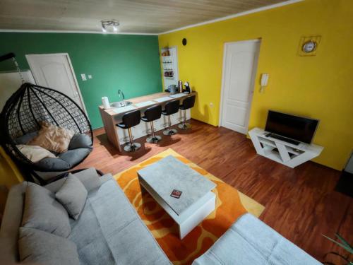 a living room with a couch and a table at City Apartman in Subotica